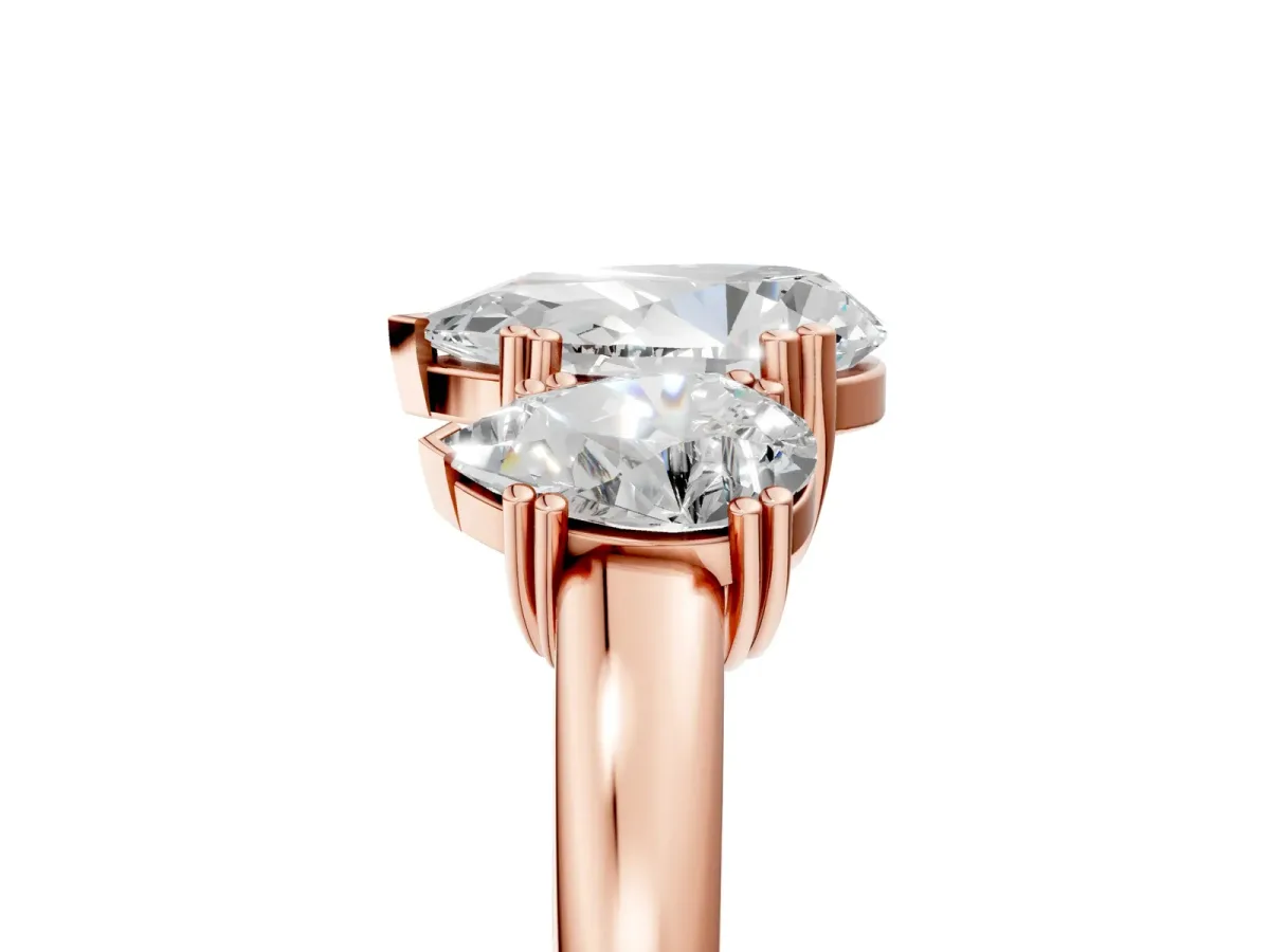 Three-Stone Pear Cut Cut Diamond Ring with Channel Set Band and Four-Prong Setting Rose gold