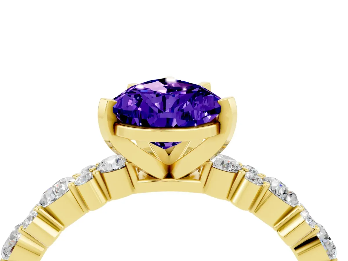 Pear Cut Tanzanite Side Stone Solitaire Ring with Round and Four-Prong Setting Yellow gold