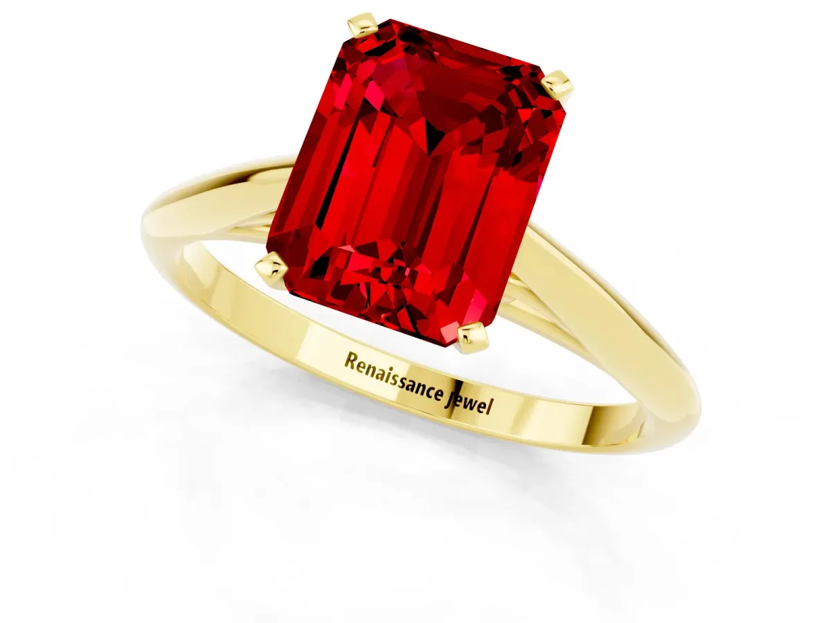Emerald Cut Ruby Solitaire Engagement Ring with Cathedral Setting and Four-Prong Mount Yellow gold