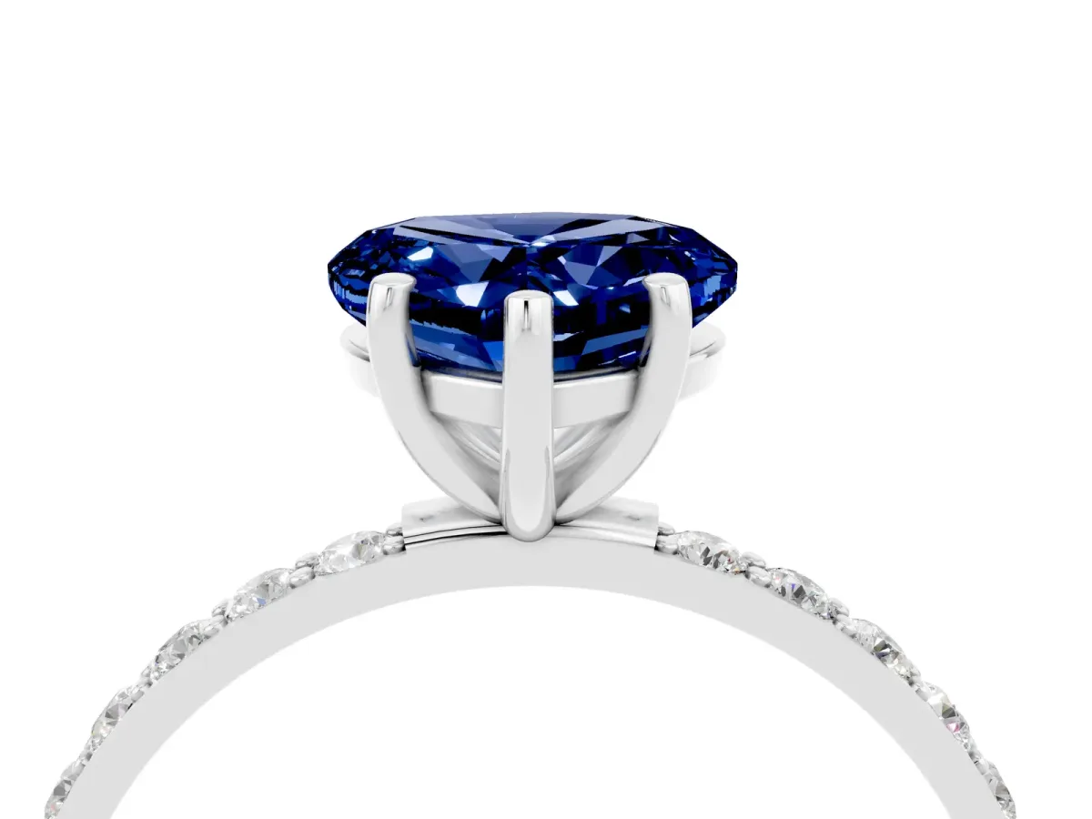 Heart Cut Blue Sapphire Solitaire Ring with Round Pavé Band and Prong Setting Silver