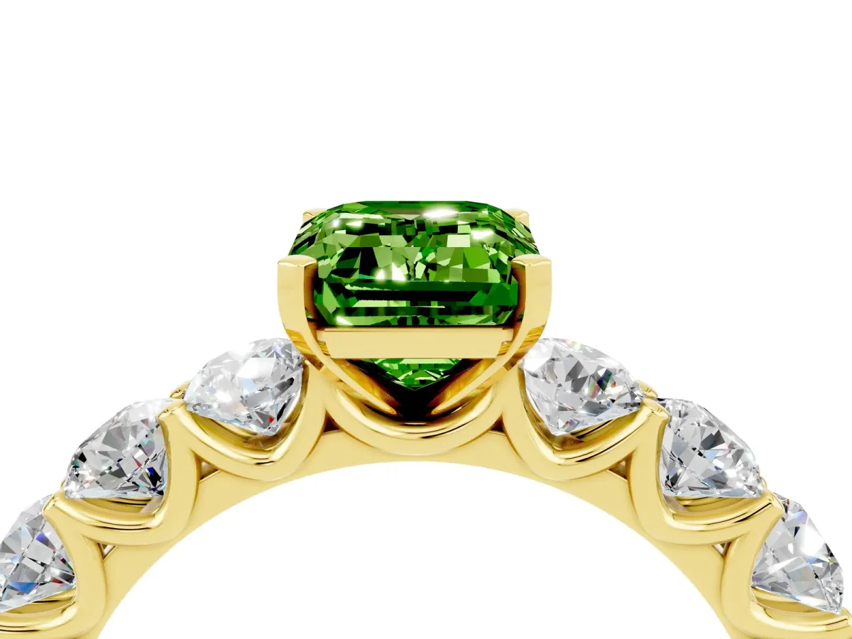 Emerald Cut Peridot Prong Setting with Side Stones on a Pave Band Yellow gold