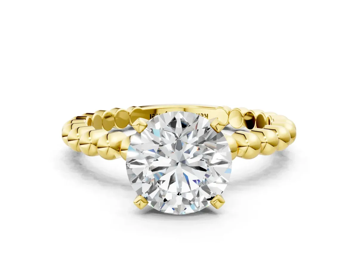 Round Cut Diamond Solitaire Ring with Beaded Band and Prong Setting Yellow gold