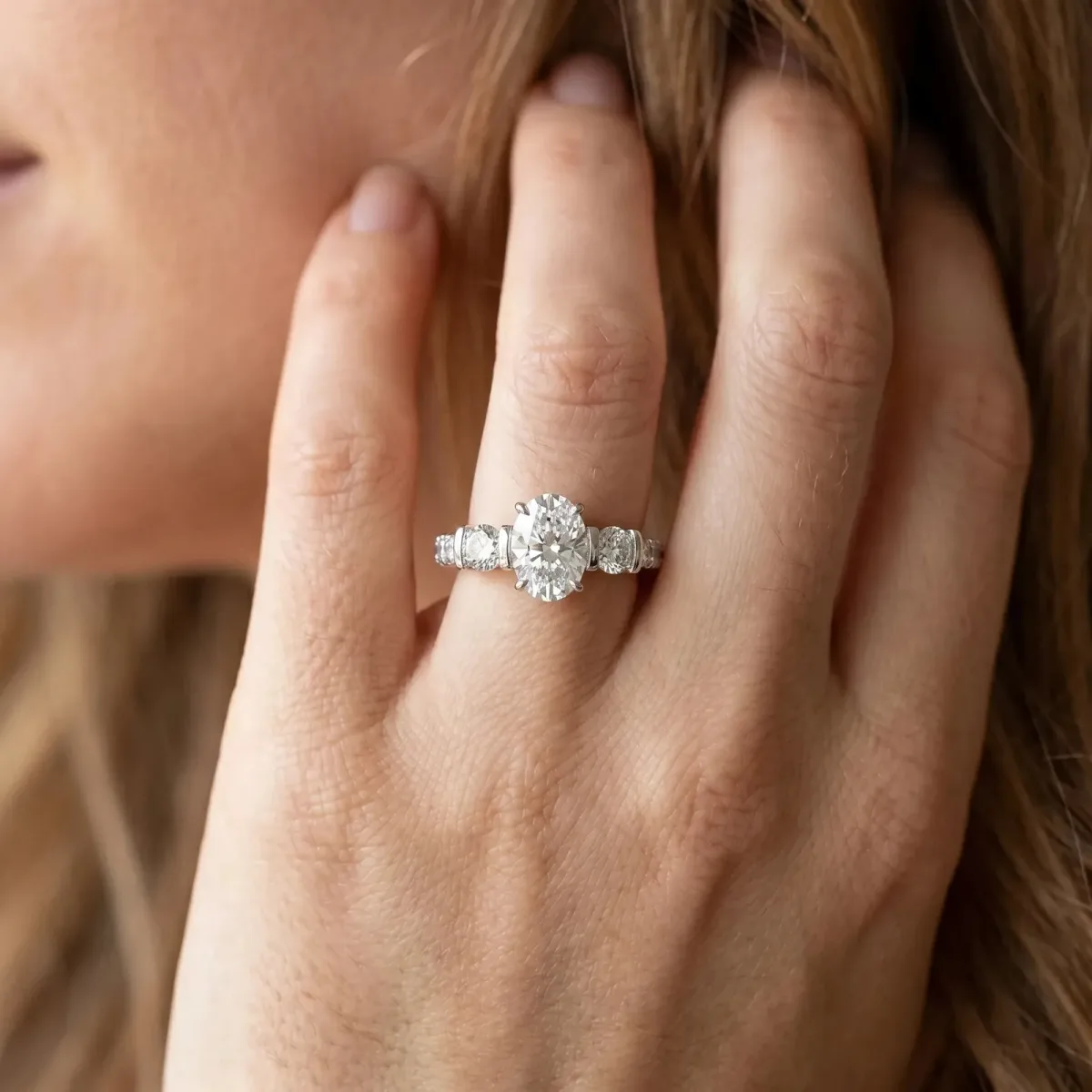 Oval Cut Brilliant Trilogy Channel Set Diamond Ring with Bar Prongs Platinum