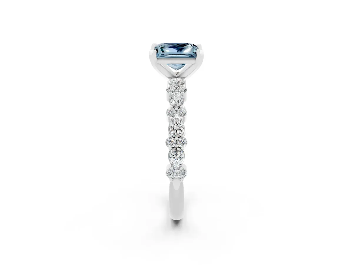 Princess Cut Aquamarine Side Stone Solitaire Ring with Round and Four-Prong Setting Platinum