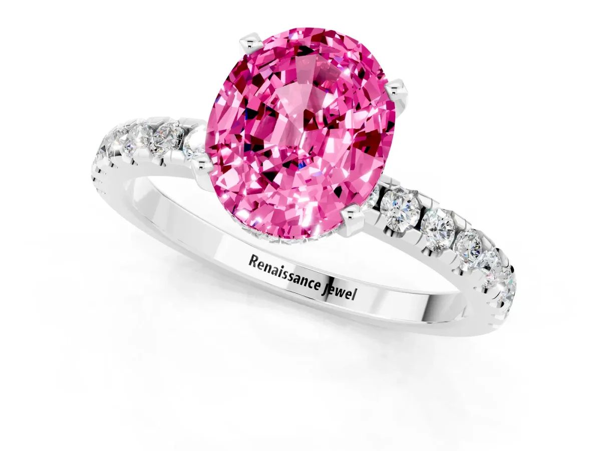 Oval Cut Pink Sapphire Solitaire Ring with Round Pavé Band and Four-Prong Setting Silver