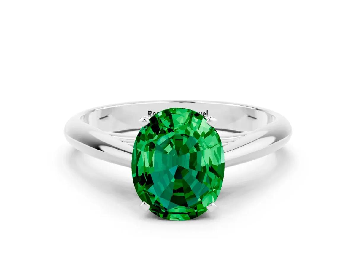 Oval Cut Emerald Solitaire Engagement Ring with Cathedral Setting and Four-Prong Mount White gold