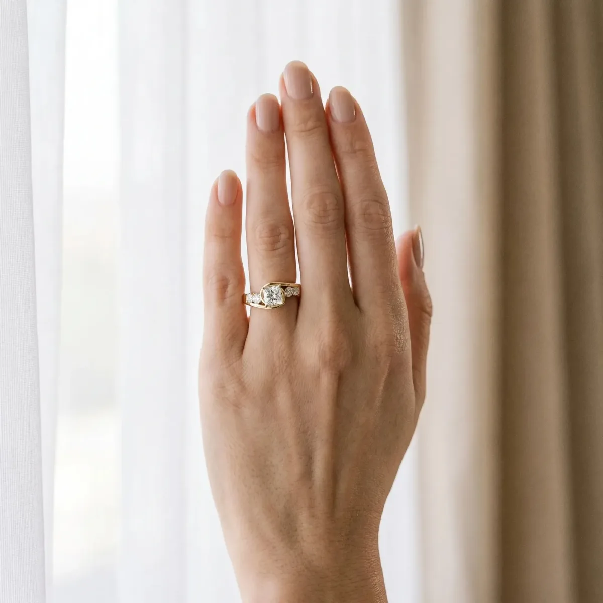 Bezel Set Princess Cut Diamond Bypass Ring with Round Accents Yellow gold