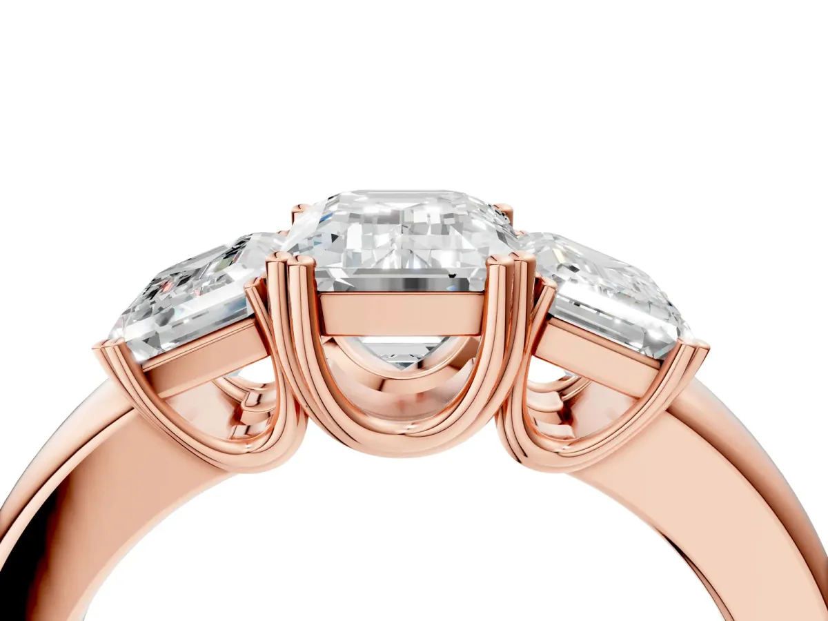 Three-Stone Emerald Cut Cut Diamond Ring with Channel Set Band and Four-Prong Setting Rose gold