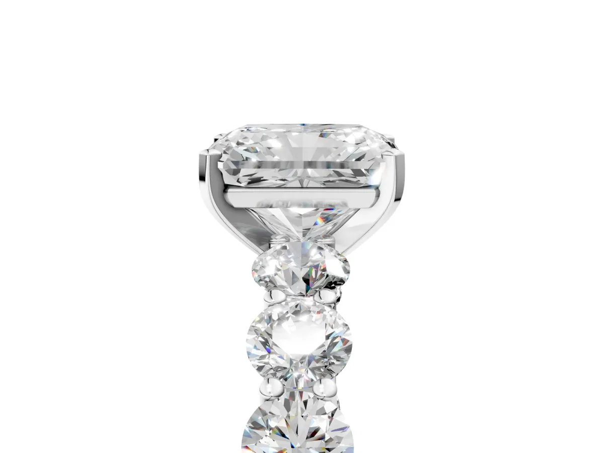 Radiant Cut Diamond Prong Setting with Side Stones on a Pave Band Silver