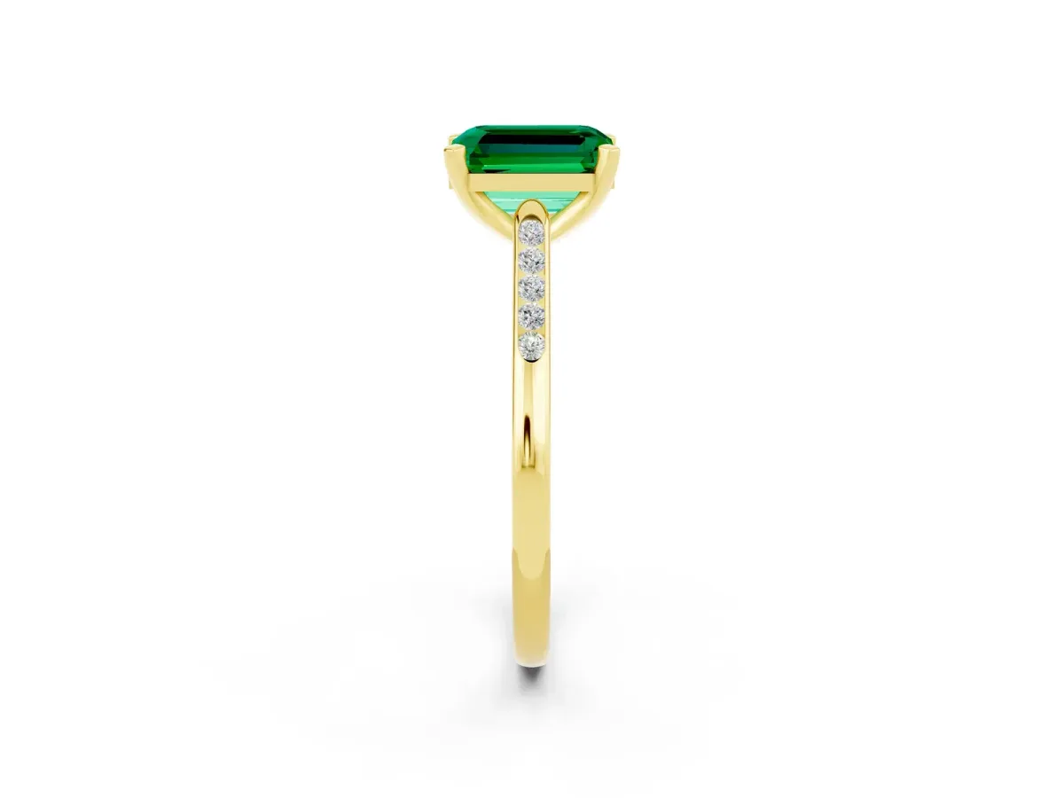 Emerald Cut Emerald Solitaire Ring with Channel Set Round Band and Prong Setting Yellow gold