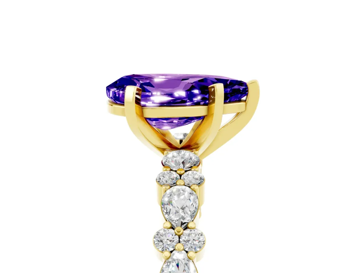 Pear Cut Tanzanite Side Stone Solitaire Ring with Round and Four-Prong Setting Yellow gold