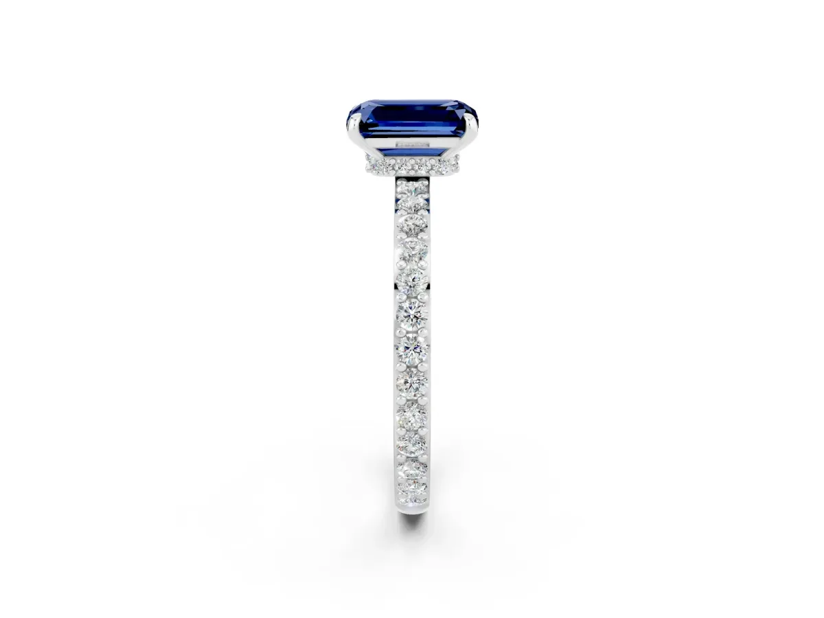 Emerald Cut Blue Sapphire Solitaire Engagement Ring with Pavé Band and Four-Prong Setting Silver