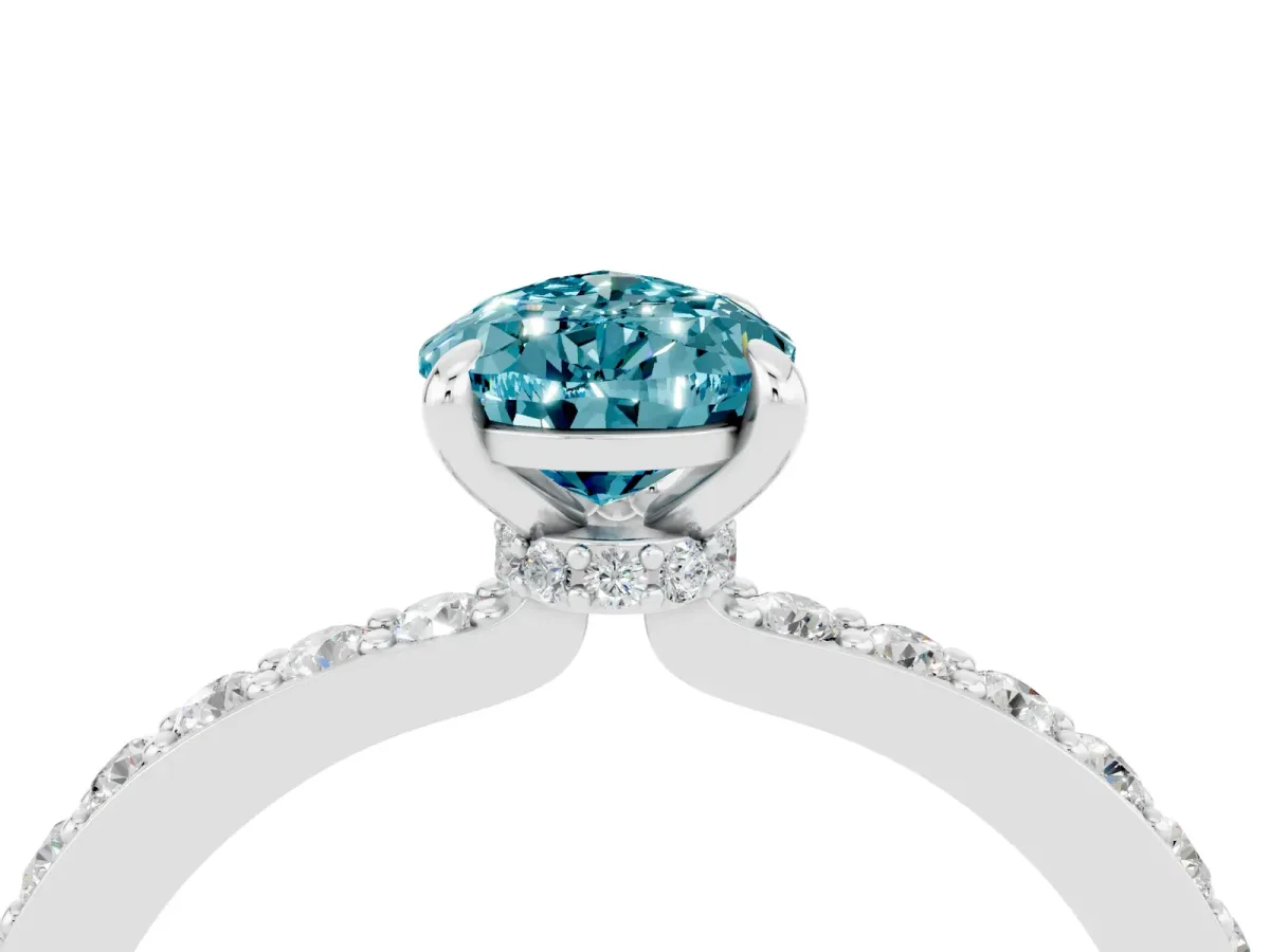 Pear Cut Blue Topaz Solitaire Engagement Ring with Pavé Band and Four-Prong Setting Silver