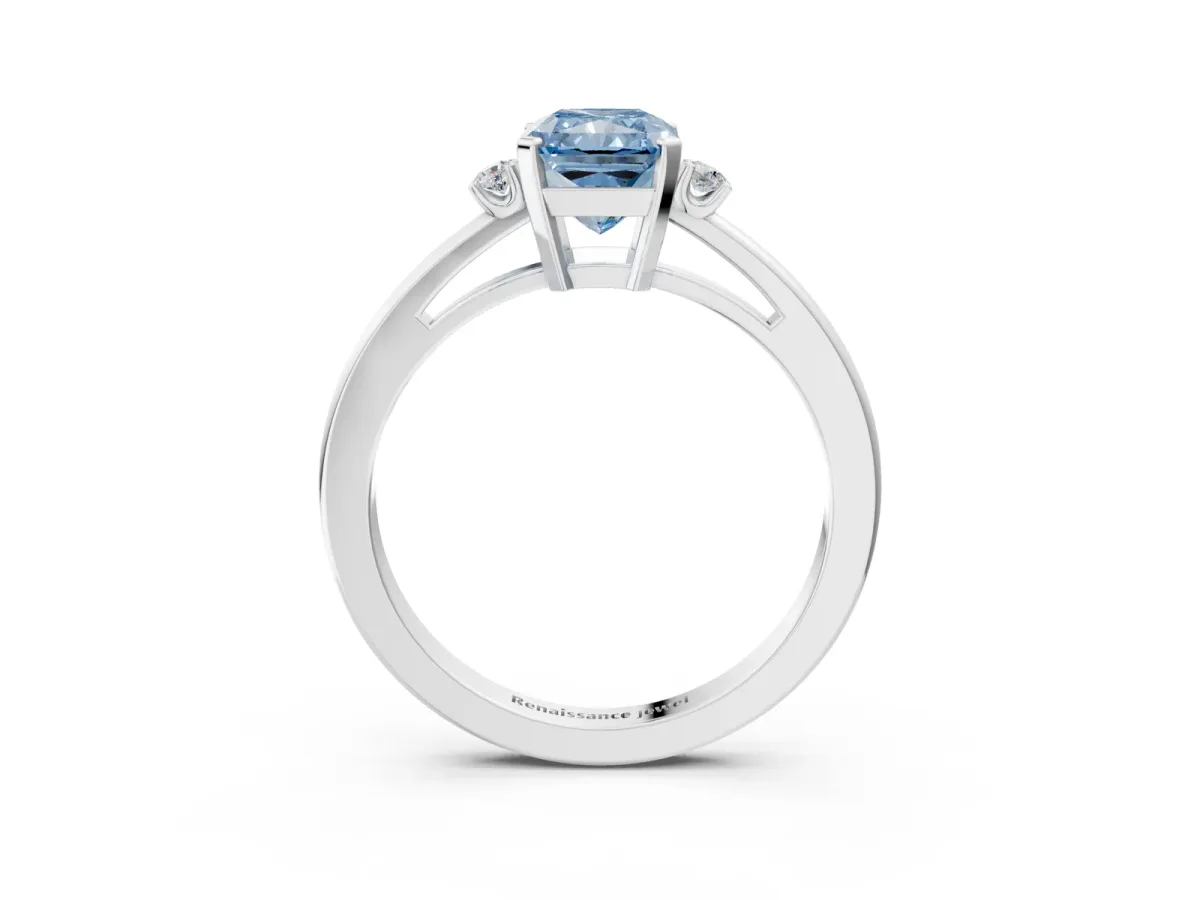 Fancy Blue Radiant Cut Cut Three-Stone Solitaire Ring with Round Accent Diamonds and Four-Prong Setting Platinum