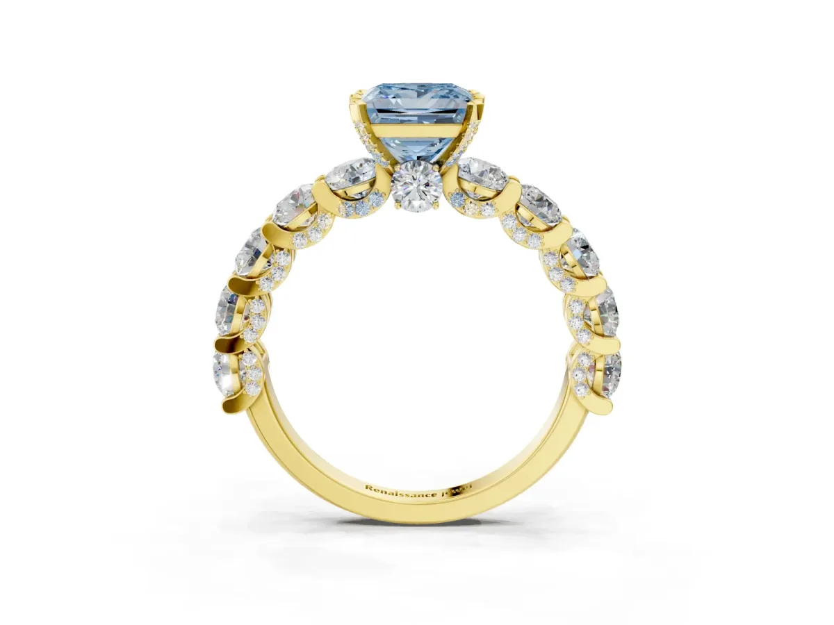 Fancy Blue Princess Cut Diamond Side Stone Engagement Ring with Four-Prong Setting Yellow gold