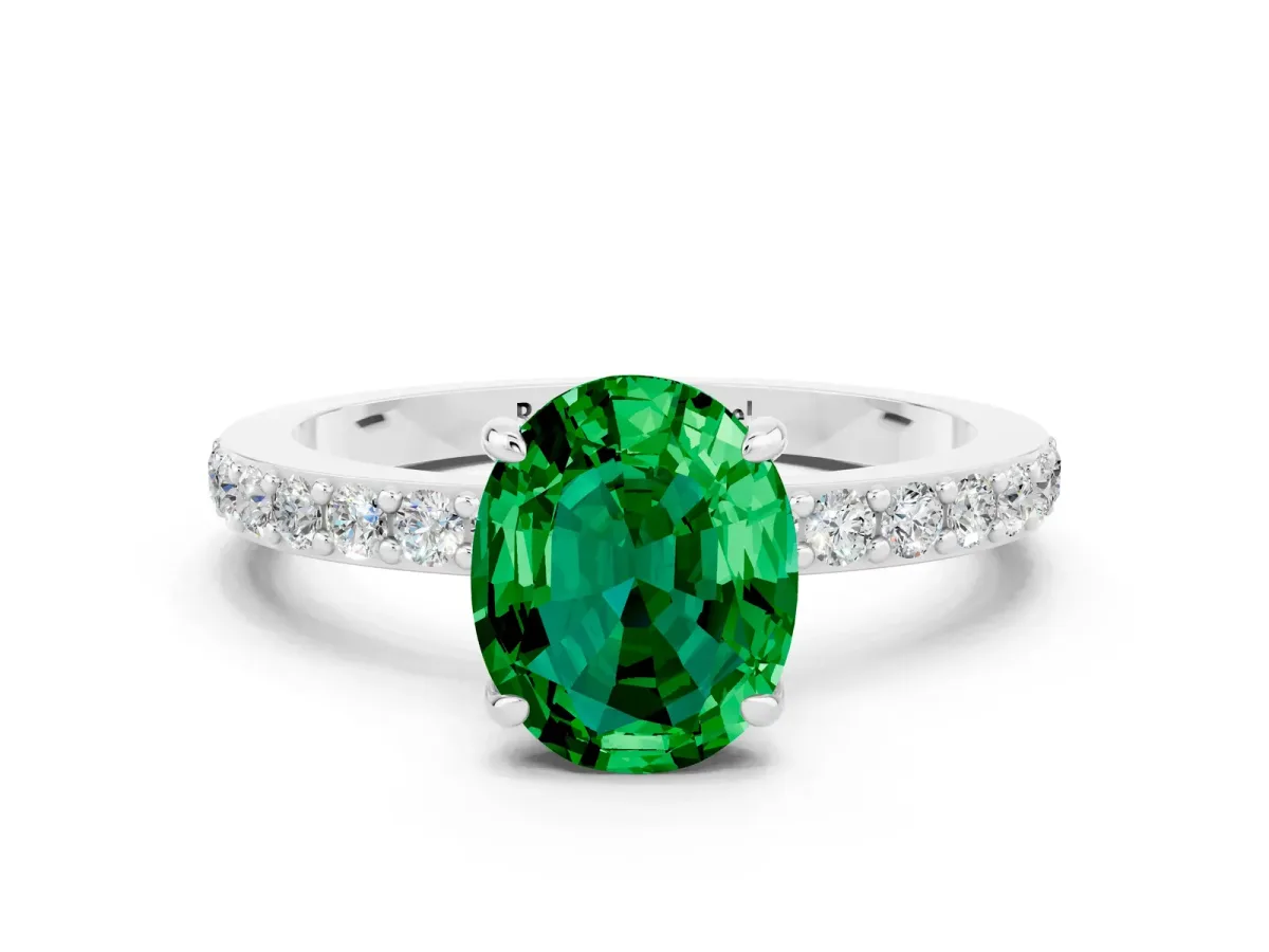 Oval Cut Emerald Solitaire Engagement Ring with Pavé Band and Four-Prong Setting Silver