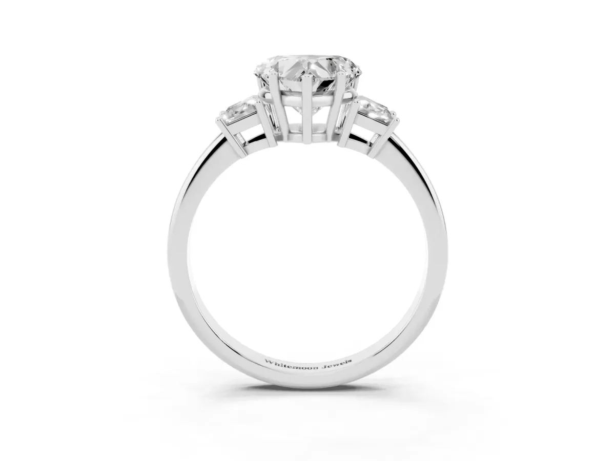Heart Cut Diamond Three-Stone Ring with Trapezoid Side Stones and Prong Setting Platinum