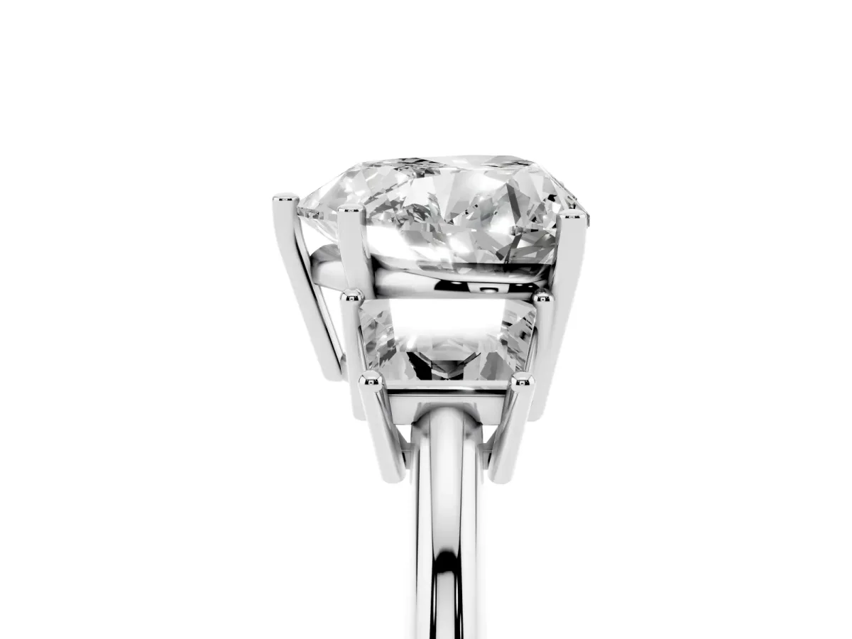Heart Cut Diamond Three-Stone Ring with Trapezoid Side Stones and Prong Setting Platinum