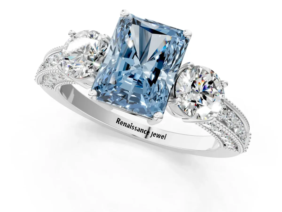 Fancy Blue Radiant Cut Three-Stone Diamond Ring with Pavé Band and Four-Prong Setting Platinum