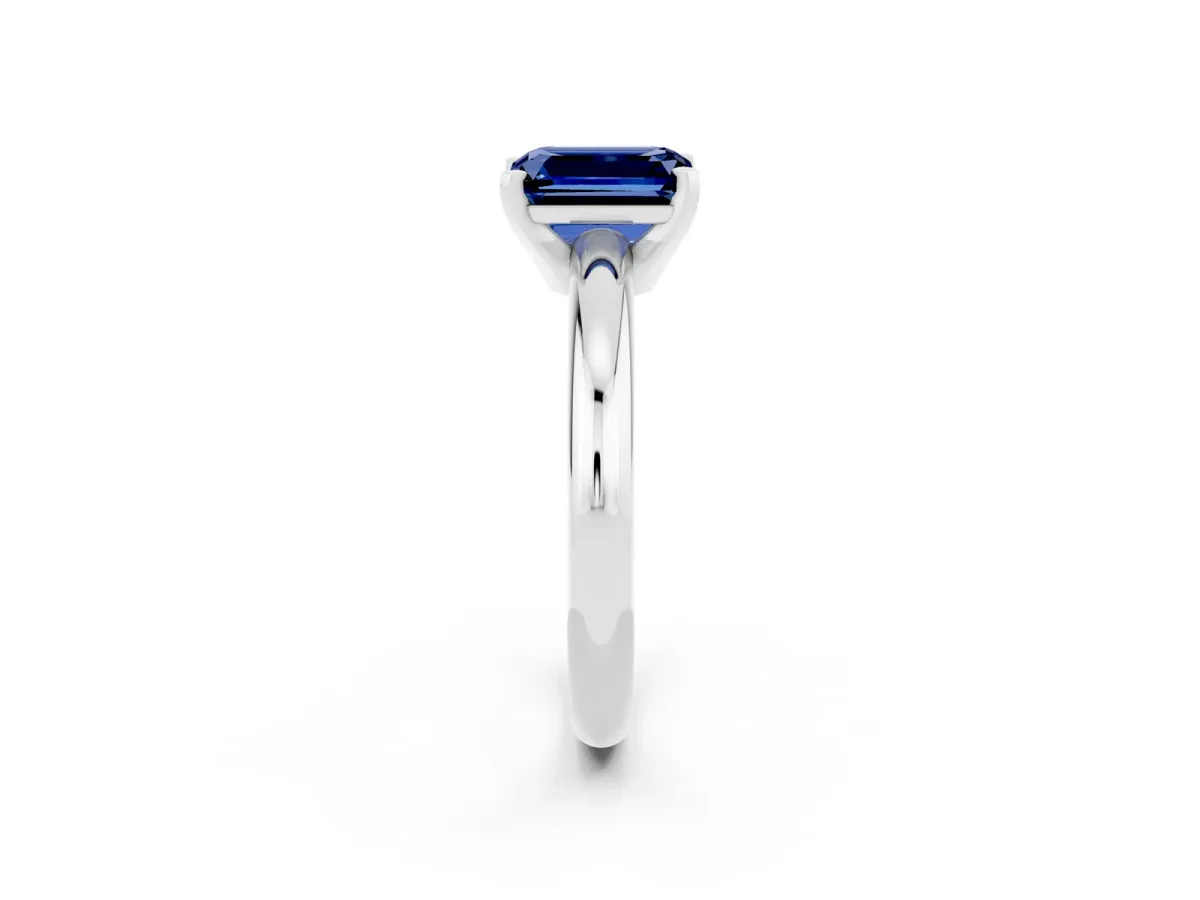Emerald Cut Blue Sapphire Solitaire Engagement Ring with Round Band and Four-Prong Setting Silver