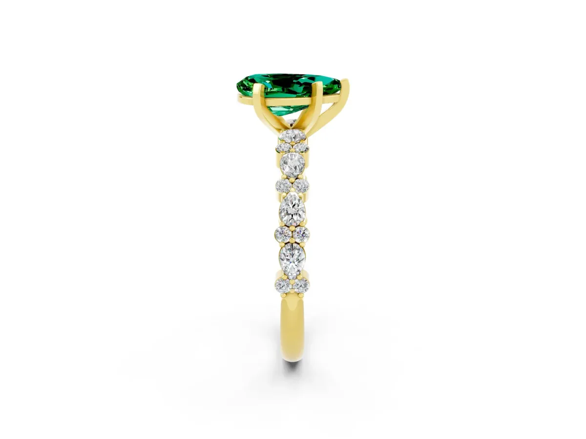 Pear Cut Emerald Side Stone Solitaire Ring with Round and Four-Prong Setting Yellow gold