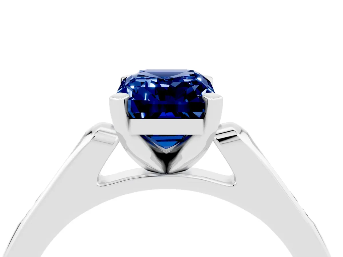 Emerald Cut Blue Sapphire Solitaire Ring with Channel Set Round Band and Prong Setting Silver