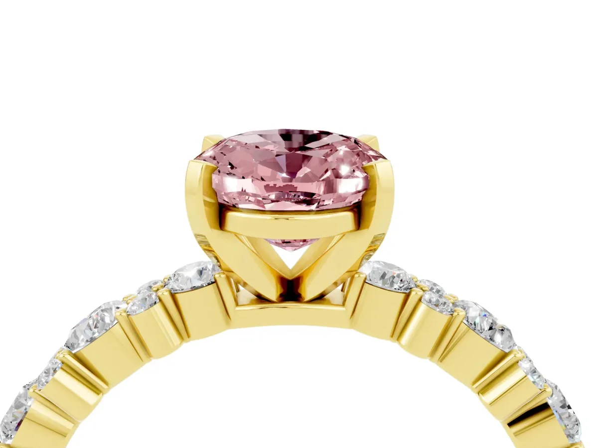 Oval Cut Morganite Side Stone Solitaire Ring with Round and Four-Prong Setting Yellow gold