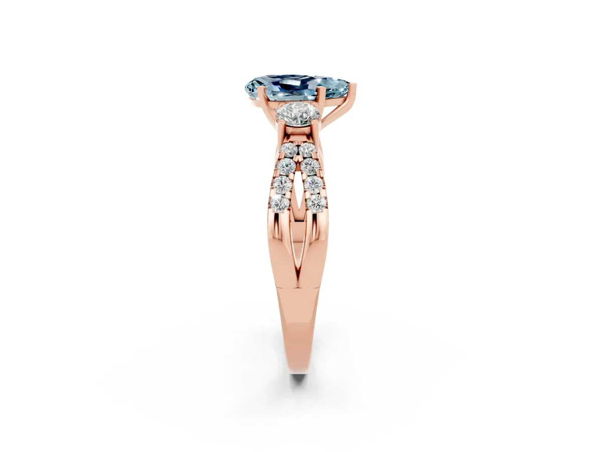 Pear Cut Aquamarine Three-Stone Ring with Pavé Split Shank and Four-Prong Setting Rose gold
