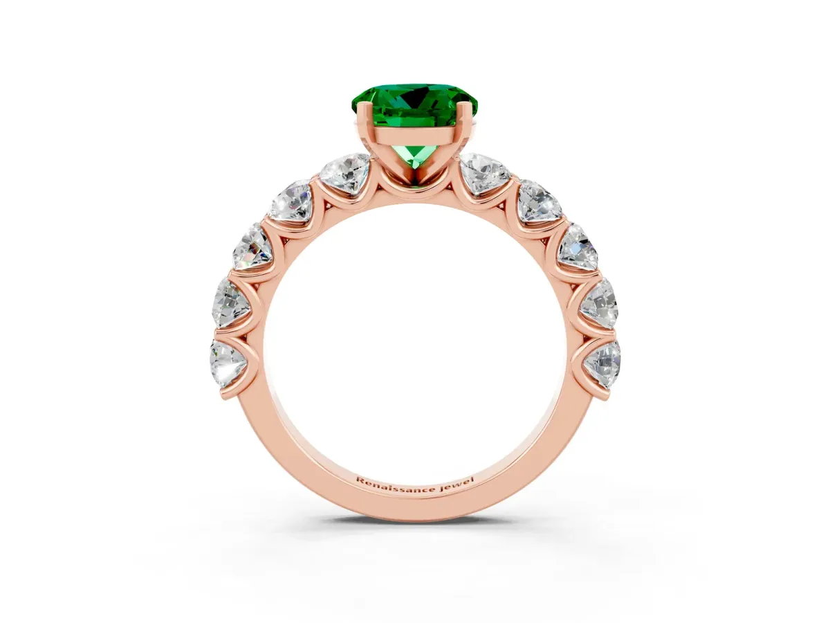 Round Cut Emerald Prong Setting with Side Stones on a Pave Band Rose gold