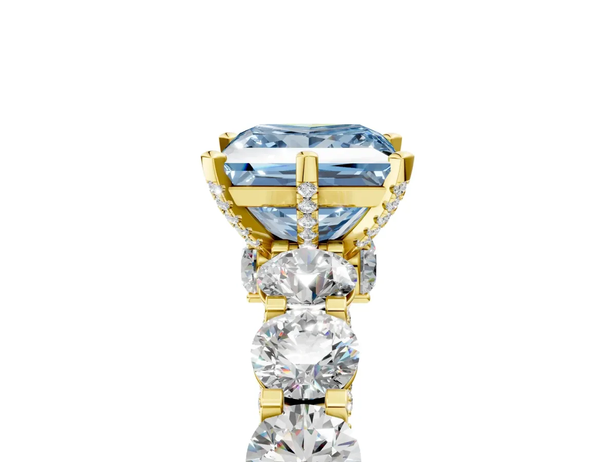 Fancy Blue Princess Cut Diamond Side Stone Engagement Ring with Four-Prong Setting Yellow gold