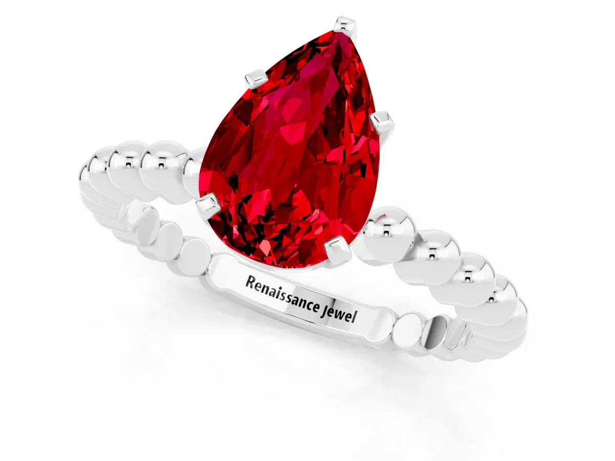 Pear Cut Ruby Solitaire Ring with Beaded Band and Prong Setting White gold