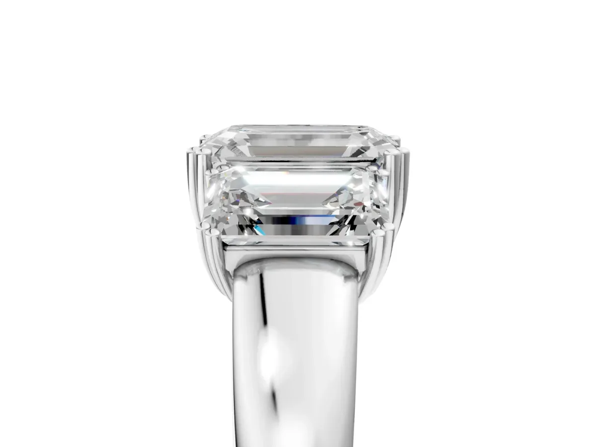 Three-Stone Emerald Cut Cut Diamond Ring with Channel Set Band and Four-Prong Setting White gold