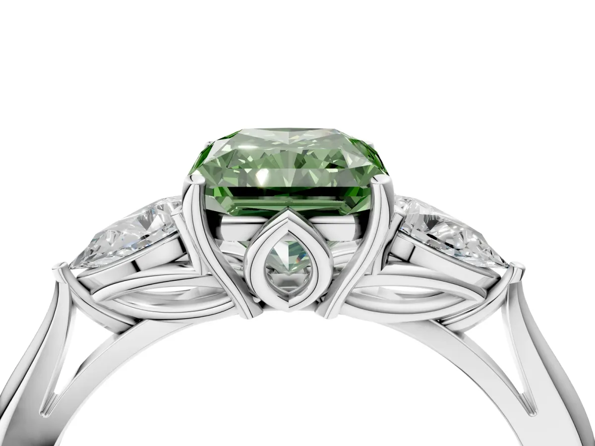 Fancy Green Three-Stone Radiant Cut Diamond Ring with Pear Side Stones in Four-Prong Setting Platinum