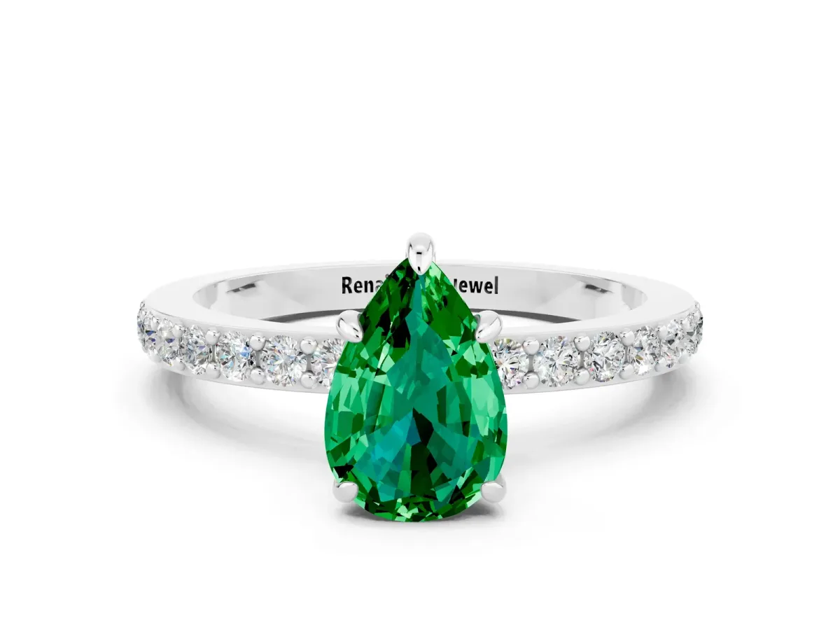 Pear Cut Emerald Solitaire Engagement Ring with Pavé Band and Four-Prong Setting Silver