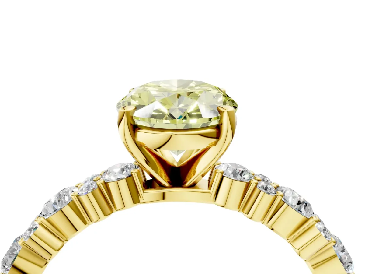 Fancy Yellow Oval Cut Diamond Side Stone Solitaire Ring with Round and Four-Prong Setting Yellow gold