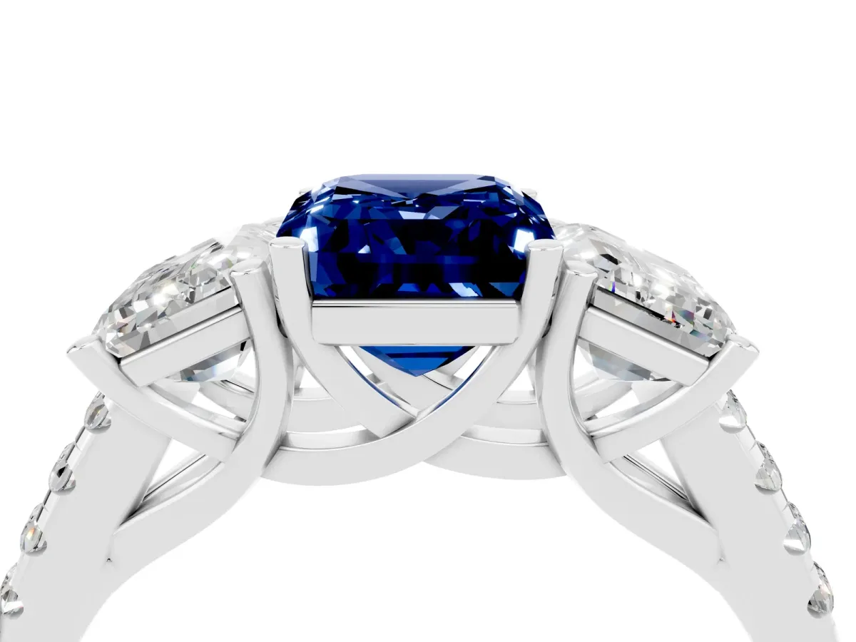 Three-Stone Emerald Cut Blue Sapphire Ring with Round Pavé Band and Prong Setting Platinum