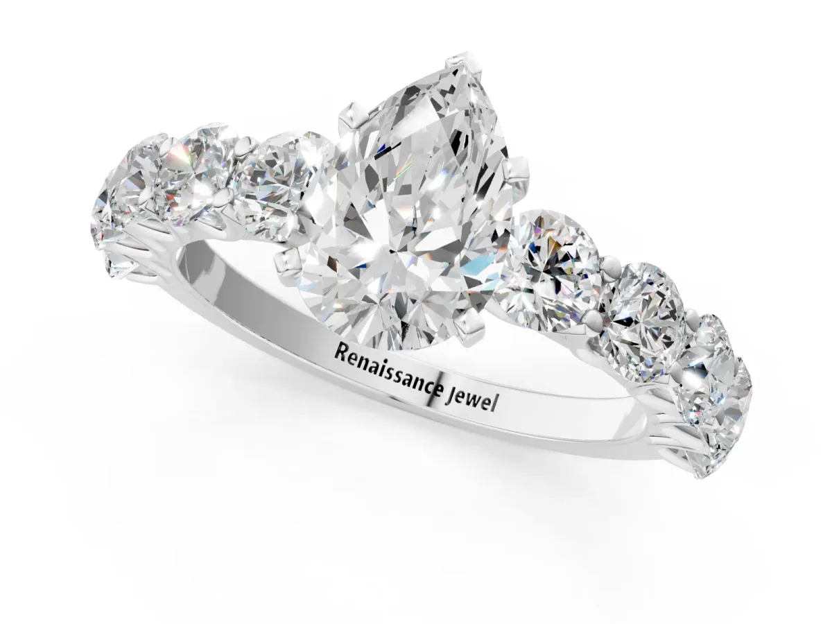 Pear Cut Diamond Prong Setting with Side Stones on a Pave Band Silver