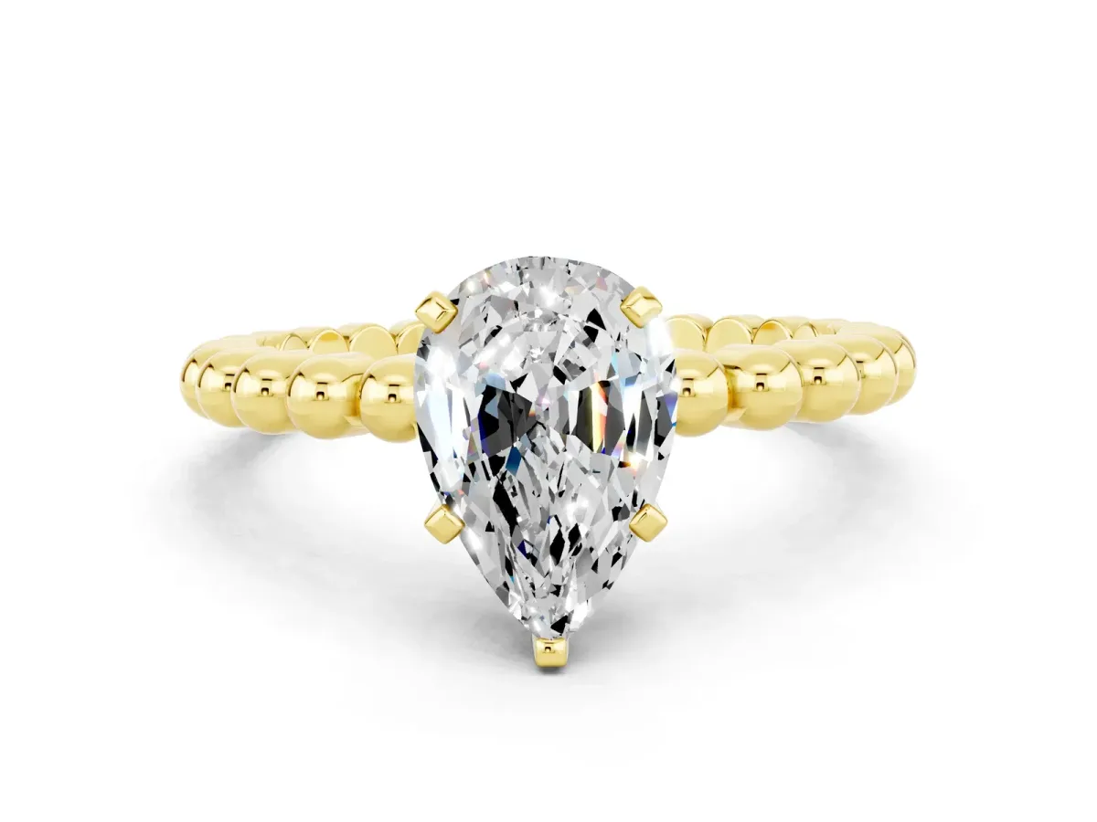 Pear Cut Moissanite Solitaire Ring with Beaded Band and Prong Setting Yellow gold