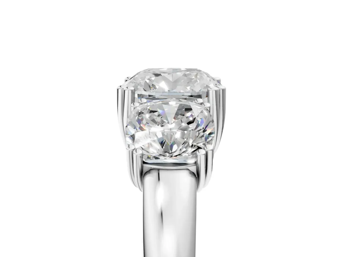 Three-Stone Cushion Cut Cut Diamond Ring with Channel Set Band and Four-Prong Setting White gold
