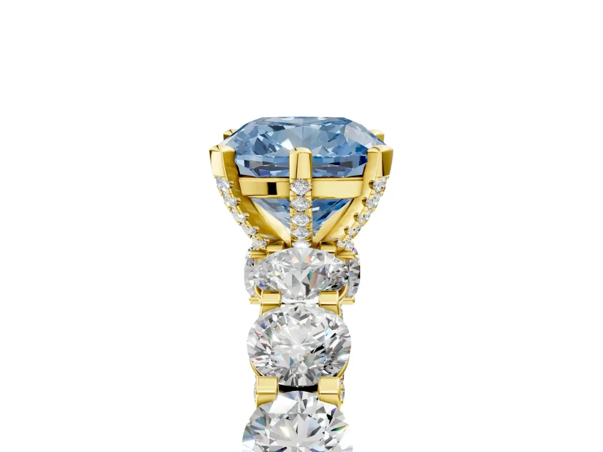 Fancy Blue Cushion Cut Diamond Side Stone Engagement Ring with Four-Prong Setting Yellow gold
