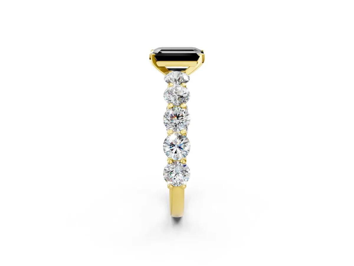 Fancy Black Emerald Cut Diamond Prong Setting with Side Stones on a Pave Band Yellow gold