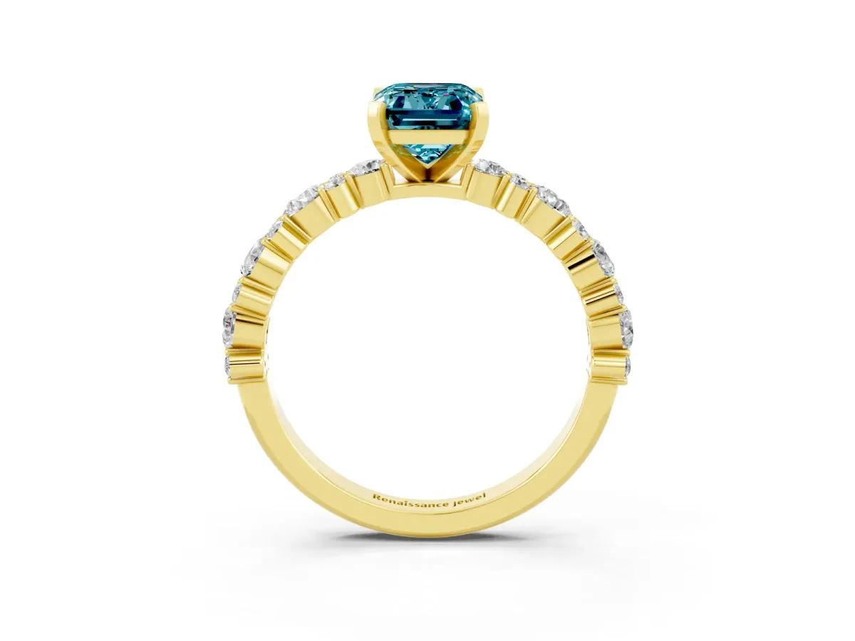 Emerald Cut Blue Topaz Side Stone Solitaire Ring with Round and Four-Prong Setting Yellow gold
