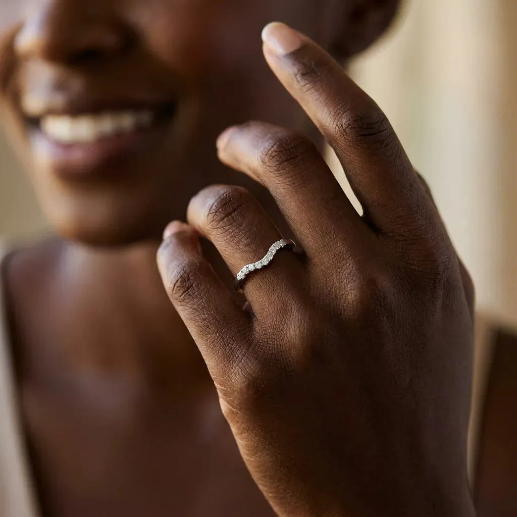Curved Diamond Wedding Band with Round Cut Stones and Shared Prong Setting Silver