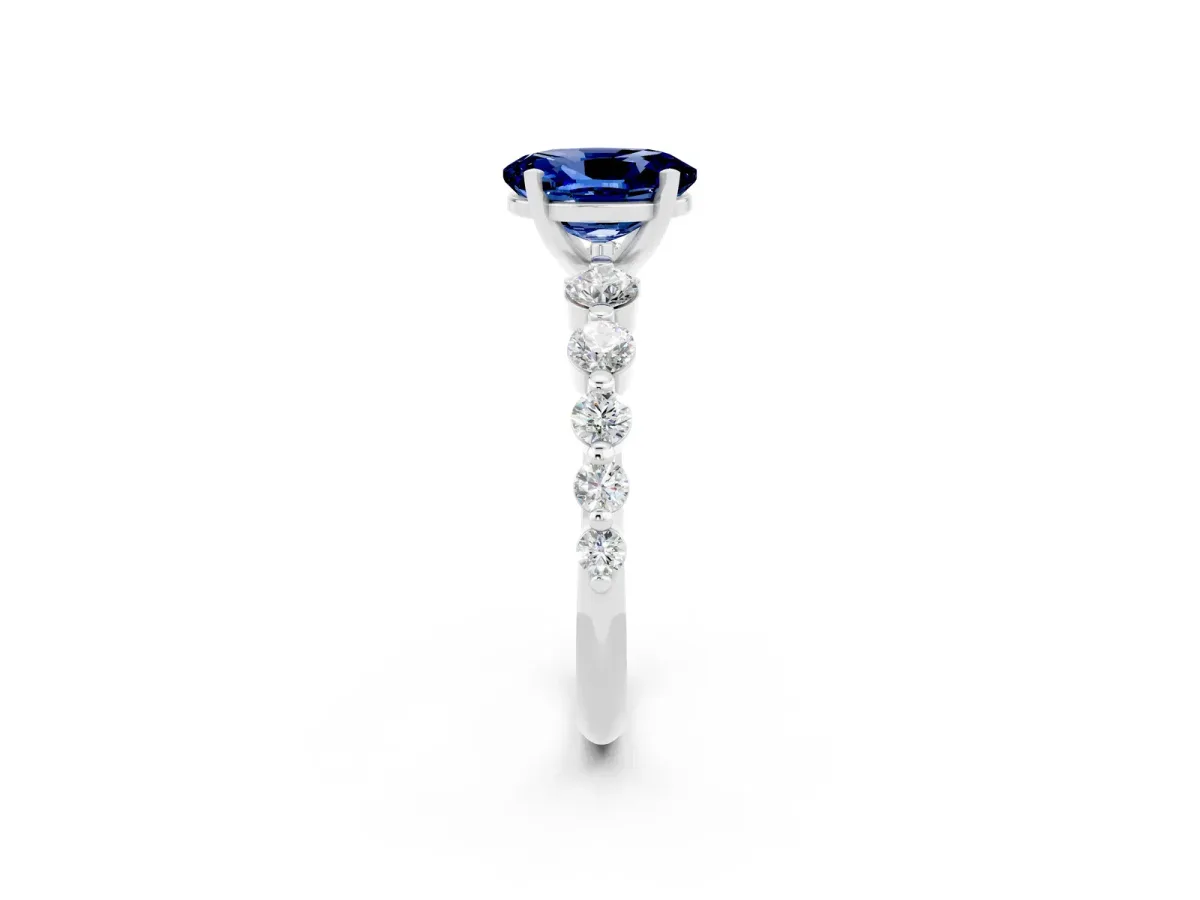 Oval Cut Solitaire Blue Sapphire Ring with Pave Band and Four-Prong Setting Silver