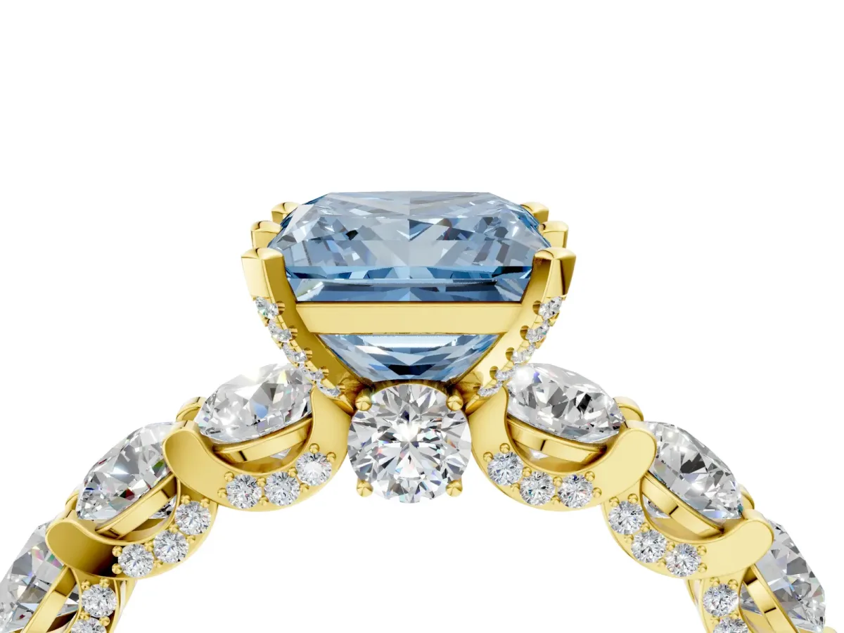 Fancy Blue Princess Cut Diamond Side Stone Engagement Ring with Four-Prong Setting Yellow gold