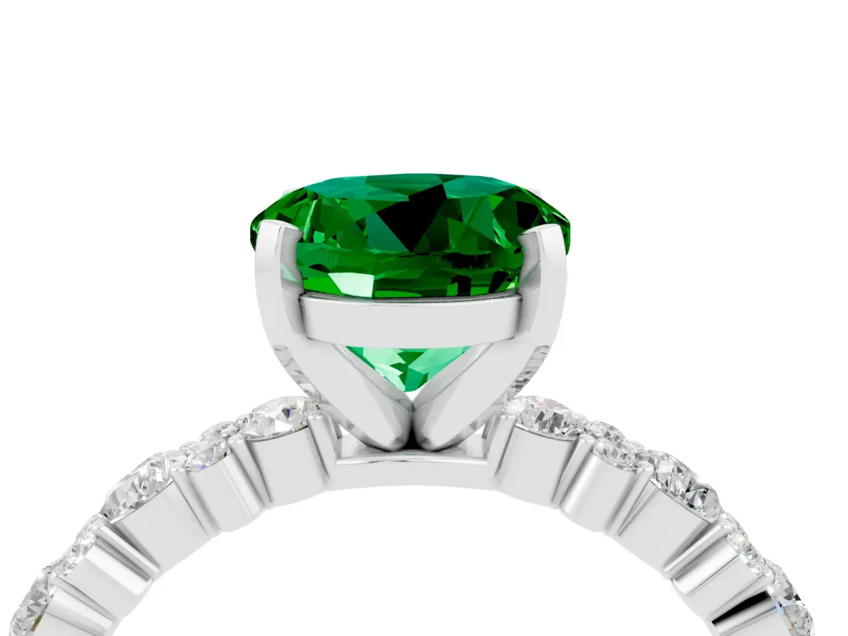 Round Cut Emerald Side Stone Solitaire Ring with Round and Four-Prong Setting Silver