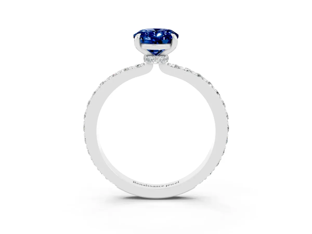 Oval Cut Blue Sapphire Solitaire Engagement Ring with Pavé Band and Four-Prong Setting Silver