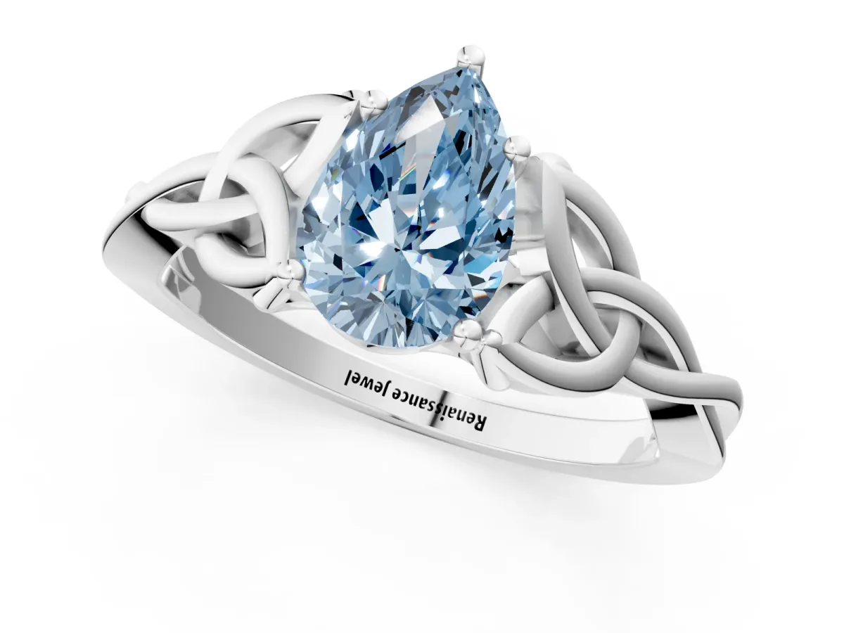 Fancy Blue Pear Cut Diamond Solitaire Engagement Ring with Celtic Knot Band and Four-Prong Setting Silver