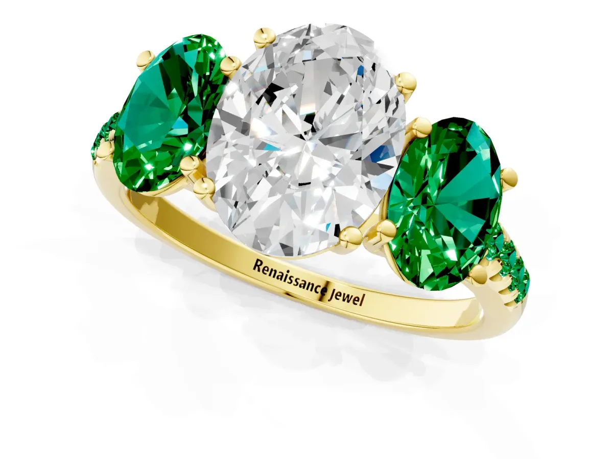 Three-Stone Oval Cut Diamond Ring with Round Emerald Pavé Band and Prong Setting Yellow gold