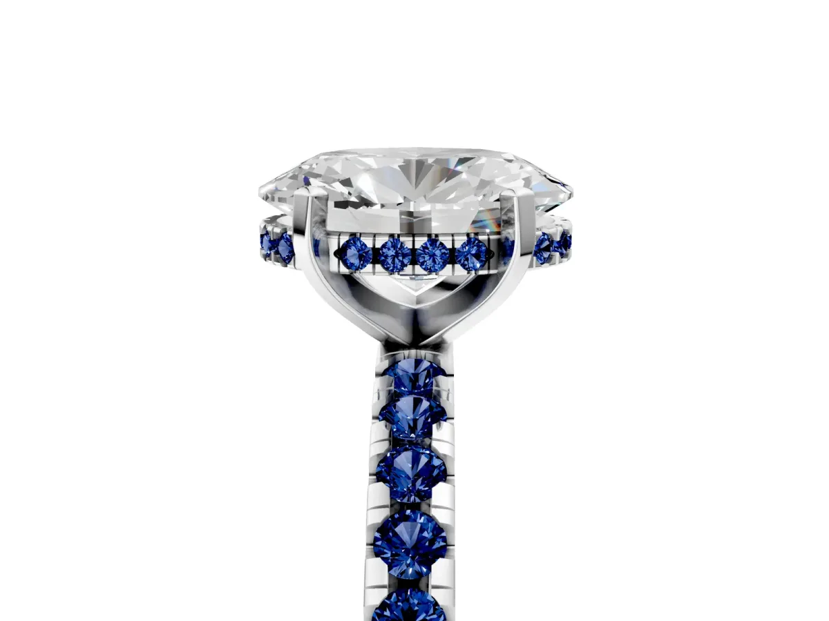 Oval Cut Diamond Solitaire Ring with Round Blue Sapphire Pavé Band and Four-Prong Setting Silver